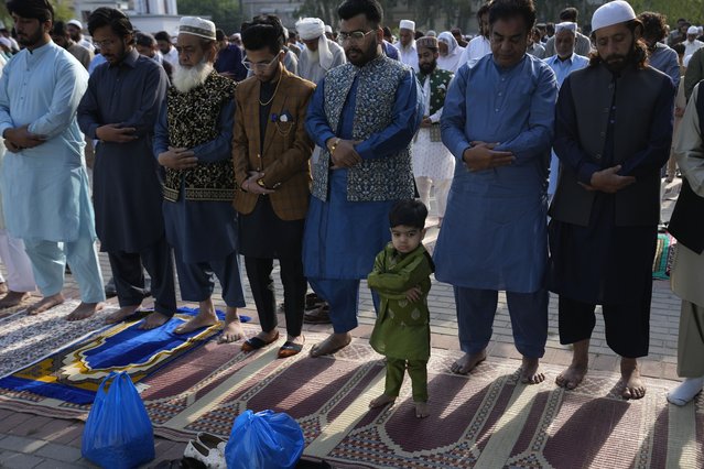 Muslims perform an Eid al-Fitr prayer, marking the end of the fasting month of Ramadan, in Rawalpindi, Pakistan, Wednesday, April, 10, 2024. (Photo by Anjum Naveed/AP Photo)