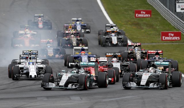 Mercedes driver Nico Rosberg of Germany, center left, steers his car steers his car on the start of the the Formula One Grand Prix race, at the Red Bull Ring in Spielberg, southern Austria, Sunday, June 21, 2015. (AP Photo/Darko Bandic)