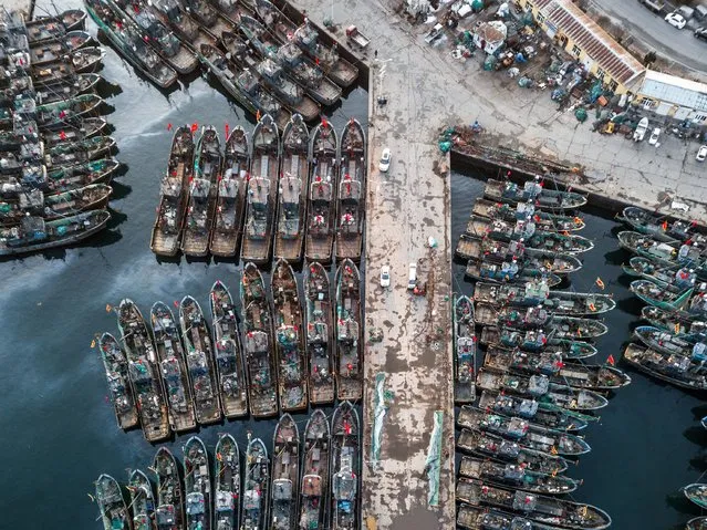 Aerial view of fishing vessels docking at a port ahead of the Chinese New Year on January 31, 2022 in Dalian, Liaoning Province of China. (Photo by VCG/VCG via Getty Images)