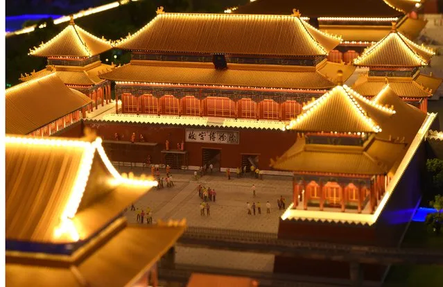 A miniature model of the Forbidden City in Beijing, China, part of Gulliver's Gate, a miniature world being recreated in a 49,000-square-foot exhibit space in Times Square, is seen during a preview April 10, 2017 in New York City. (Photo by Timothy A. Clary/AFP Photo)
