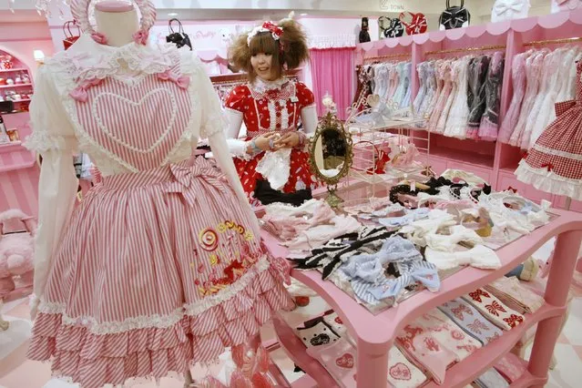 A shop attendant dressed in lolita fashion works in a shop at Marui One, a branch of department store group Marui Co. Ltd., at Tokyo's Shinjuku district in this March 2, 2009 file photo. (Photo by Issei Kato/Reuters)
