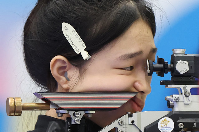 China's Huang Yuting competes in the shooting 10m Air Rifle Mixed Team Gold Medal during the Paris 2024 Olympic Games at Chateauroux Shooting Centre on July 27, 2024. (Photo by Alain Jocard/AFP Photo)