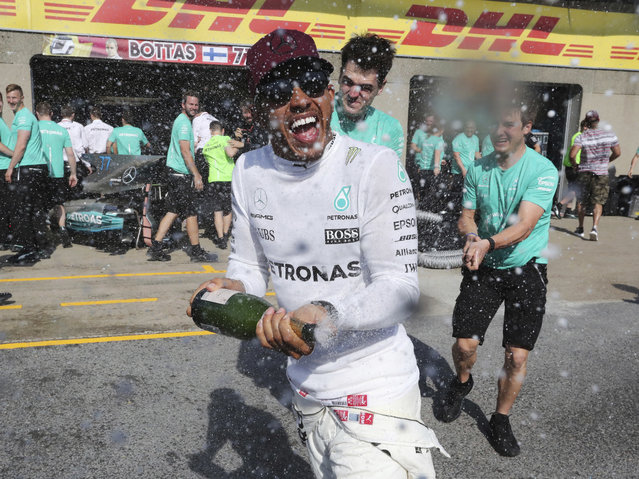 Mercedes driver Lewis Hamilton, of Britain, celebrates after winning the Formula One Canadian Grand Prix in Montreal on Sunday, June 11, 2017. (Photo by Tom Boland/The Canadian Press via AP Photo)