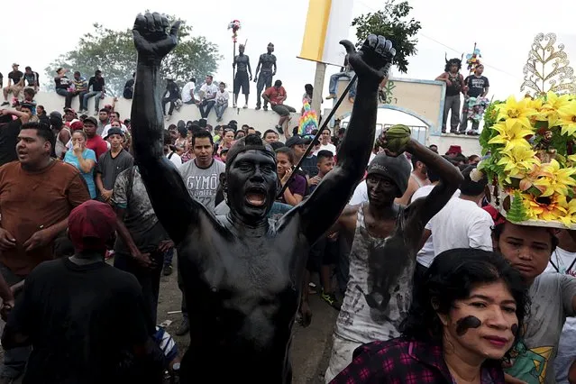 A devotee covered in motor oil takes part in celebrations honouring the patron saint of Managua, Santo Domingo de Guzman, in Managua, Nicaragua, August 1, 2015. (Photo by Oswaldo Rivas/Reuters)