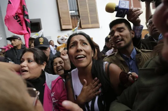 Supporters of presidential candidate Pedro Pablo Kuczynski celebrate after learning that Peruvian electoral authorities announced their candidate won the majority of votes in the country's closest presidential contest in five decades, in Lima, Peru, Thursday, June 9, 2016. Four days after voting, the electoral board said that all ballots had been processed and Kuczynski had won 51.1 percent compared to 49.9 percent for the daughter of imprisoned ex-President Alberto Fujimori. (Photo by Silvia Izquierdo/AP Photo)