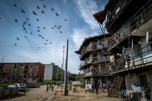 Birds fly above the Roma settlement at the Lunik IX quarter of Slovakia's second largest city of Kosice, Sunday, September 5, 2021. Pope Francis will make his visit to the impoverished Roma community in Slovakia one of the highlights of his pilgrimage to “the heart of Europe”. Francis will be the first pontiff to meet the most socially excluded minority group in that Central European country. (Photo by Peter Lazar/AP Photo)