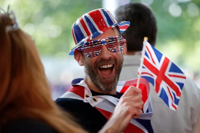 A man with a Union Jack flag and hat attends the Queen's Platinum Jubilee celebrations at The Mall in London, Britain on June 2, 2022. (Photo by Peter Nicholls/Reuters)