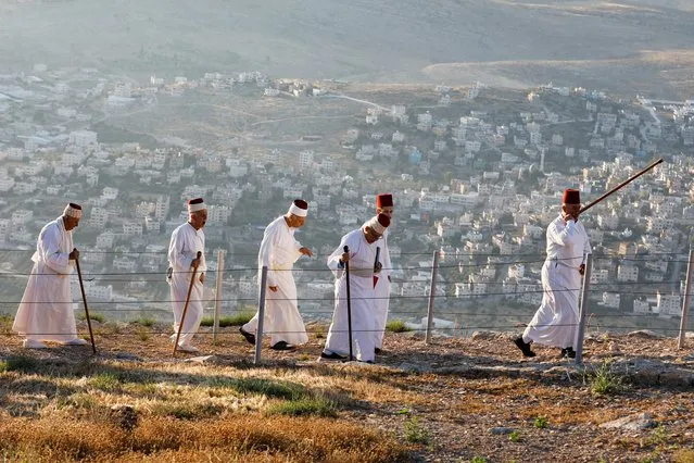 Members of the Samaritan sect take part in a traditional pilgrimage marking the holiday of Shavuot, atop Mount Gerizim, in Nablus in the Israeli-occupied West Bank, June 5, 2022. (Photo by Raneen Sawafta/Reuters)