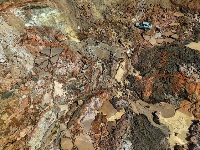 Aerial view of a car in the middle of a landslide in the Terra Preta Port on the banks of the Solimoes River in Manacapuru, Amazonas State, northern Brazil, on October 8, 2024. (Photo by Michael Dantas/AFP Photo)