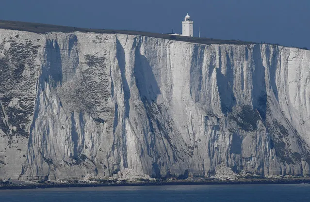 South Foreland lighthouse and the white cliffs of Dover are seen from a cross-channel ferry between Dover in Britain and Calais in France, March 27, 2017. (Photo by Toby Melville/Reuters)