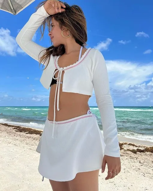 Cuban-American singer-songwriter Camila Cabello wears a cardigan on the beach in Miami in the first decade of July 2022. (Photo by camila_cabello/Instagram)