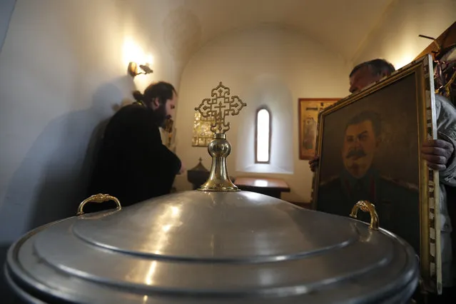 A Georgian man carries a portrait of former Soviet dictator Joseph Stalin during a service marking the 67th anniversary of his death in a church in his native town Gori, some 80 kilometers from the Georgian capital of Tbilisi, Georgia, 05 March 2020. Josef Stalin died on 05 March 1953 at the age of 74. (Photo by Zurab Kurtsikidze/EPA/EFE)