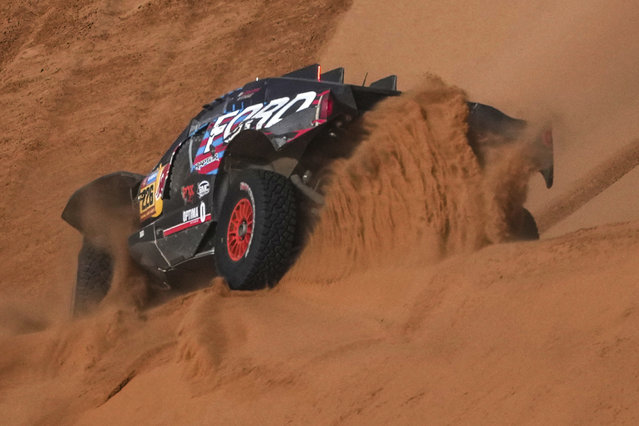 Driver Mattias Ekstrom and co-driver Emil Bergkvist compete during the eighth stage of the Dakar Rally between Al Duwadimi and Riyadh, Saudi Arabia, Monday, January 13, 2025. (Photo by Christophe Ena/AP Photo)