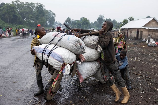 A person holds bags of potatoes from the Kibati market, on a traditional scooter (chukudu), to sell in Goma, days after the M23 rebel group seized the town of Goma, North Kivu province, in eastern Democratic Republic of the Congo, on February 2, 2025. (Photo by Arlette Bashizi/Reuters)