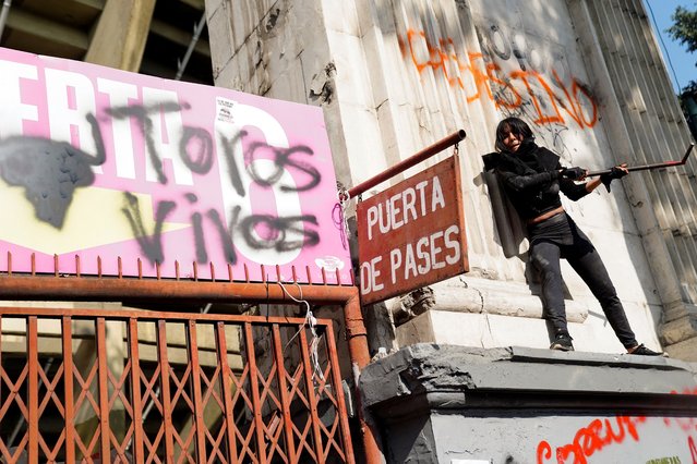 A demonstrator takes part in a protest against the return of bullfighting, outside the Plaza de Toros Mexico bullfighting ring, in Mexico City, Mexico, on January 28, 2024. (Photo by Toya Sarno Jordan/Reuters)