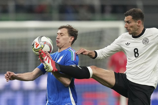 Germany's Leon Goretzka vies for the ball with Italy's Nicolo Barella, left, during the Nations League quarterfinals first leg soccer match between Italy and Germany, at the San Siro stadium in Milan, Italy, Thursday, March 20, 2025. (Photo by Antonio Calanni/AP Photo)