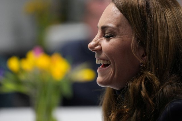 Britain's Catherine, Princess of Wales, Patron of the Rugby Football Union (RFU), laughs as she meets injured players who are supported by the Welsh Rugby Charitable Trust before she attends the Wales versus England Six Nations match at the Principality Stadium in Cardiff, on Saturday, March 15, 2025. (Photo by Alastair Grant/Pool via Reuters)