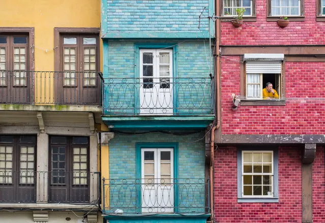 “Porto”. The colorful buildings of Porto drew my eye and the man in the open window provided an added focal point. Photo location: Porto, Portugal. (Photo and caption by Keith Urry/National Geographic Photo Contest)