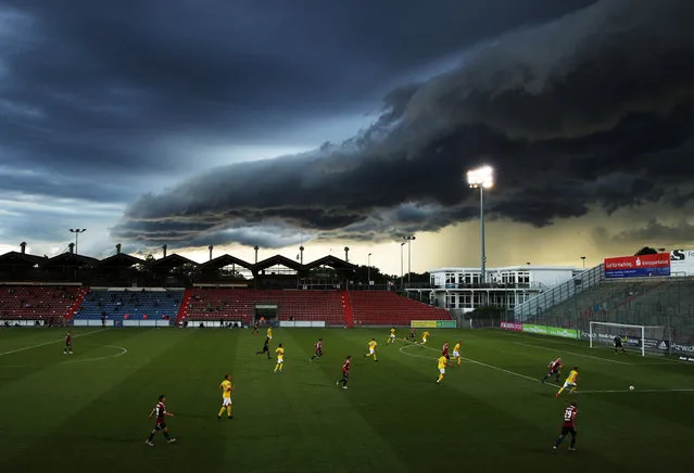 Maximilian Krauss of SpVgg Unterhaching makes a run while a massive shelf cloud rolls in during the 3. Liga match between SpVgg Unterhaching and FC Carl Zeiss Jena at Alpenbauer Sportpark on July 01, 2020 in Unterhaching, Germany. (Photo by Adam Pretty/Bongarts/Getty Images)