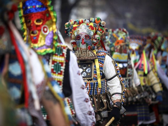 Masked Bulgarian dancers perform during the 30th International Festival of Masquerade Games “Surva” in the town of Pernik, Bulgaria Saturday, January 27, 2024. The carnival in the city of Pernik, attracts a record number of participants from all over the country, as well as foreign dancers from across Europe. It marks the culmination of traditional winter festivities that are believed to date back to pagan times. (Photo by Valentina Petrova/AP Photo)