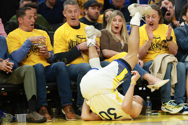 Stephen Curry #30 of the Golden State Warriors falls on the court after he was fouled as he made a three-point basket against the Memphis Grizzlies in the first half of the NBA play-in tournament game at Chase Center on April 15, 2025 in San Francisco, California. (Photo by Ezra Shaw/Getty Images/AFP Photo)