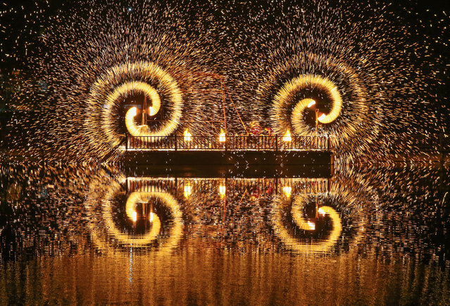 Photo taken on February 11, 2024 shows traditional fireworks “Ironcraft Flowers” at Yuwan Scenic spot in Lianyungang, East China's Jiangsu province. (Photo by CFOTO/Future Publishing via Getty Images)