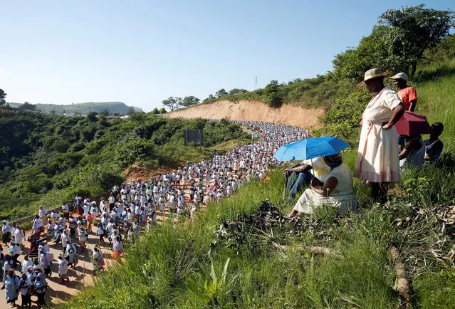 Members of the Shembe faith (Nazareth Baptist Church), a religious hybrid of Christianity and African traditions, walk during their annual pilgrimage near Inanda, South Africa, January 3, 2018. (Photo by Rogan Ward/Reuters)