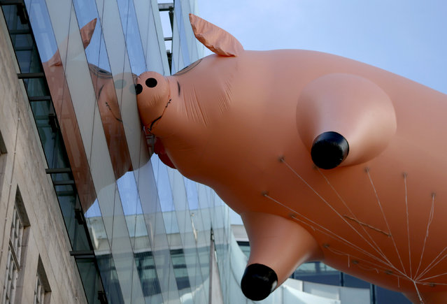The Pink Floyd inflatable pig floats next to Broadcasting House to promote their new exhibition at the V&A museum, in London, Britain May 10, 2017. (Photo by Neil Hall/Reuters)