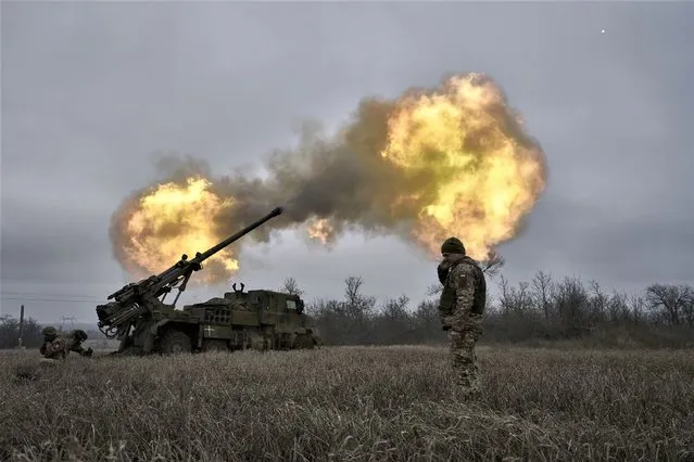 Ukrainian soldiers fire a French-made CAESAR self-propelled howitzer towards Russian positions near Avdiivka, Donetsk region, Ukraine, Monday, December 26, 2022. (Photo by Libkos/AP Photo)