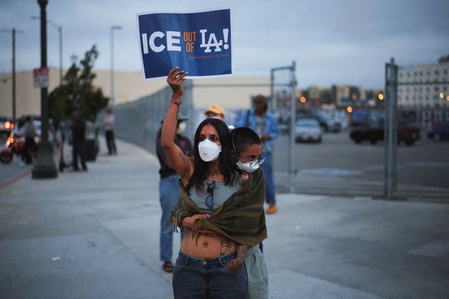 A demonstrator holds a placard as protesters gather around the Los Angeles Federal Building following multiple detentions by Immigration and Customs Enforcement (ICE), in downtown Los Angeles, California, U.S., June 6, 2025. (Photo by Daniel Cole/Reuters)