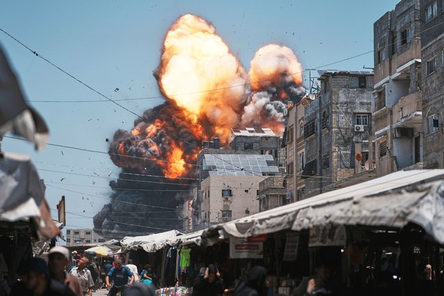 Thick smoke and flames erupt from an Israeli airstrike in Gaza City, Sunday, June 1, 2025. (Photo by Jehad Alshrafi/AP Photo)