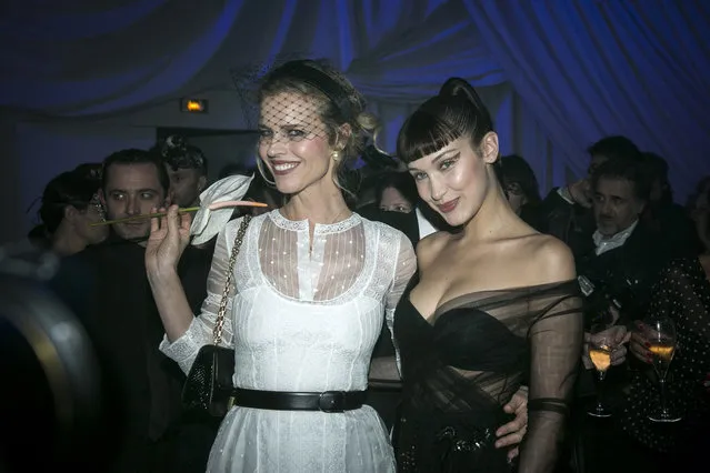 Model Eva Herzigova, left, and model Bella Hadid attend the “Grand Bal Christian Dior” during the Haute Couture Spring-Summer 2018 fashion collection presented in Paris, early Tuesday, January 23, 2018. (Photo by Kamil Zihnioglu/AP Photo)