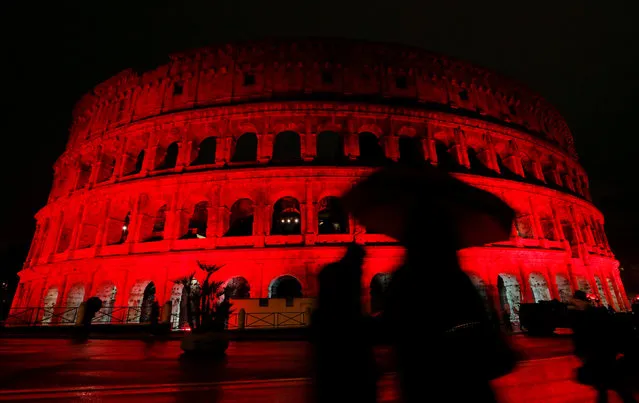 The Colosseum is lit up in red to draw attention to the persecution of Christians around the world in Rome, Italy, February 24, 2018. (Photo by Remo Casilli/Reuters)