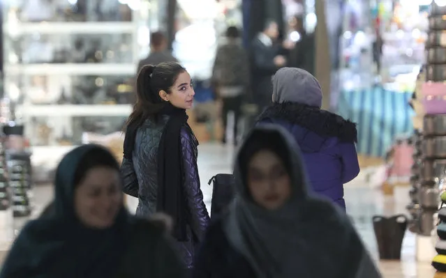Iranians walk through Tehran Bazaar, in Tehran, Iran on December 5, 2022. (Photo by Majid Asgaripour/WANA (West Asia News Agency) via Reuters)