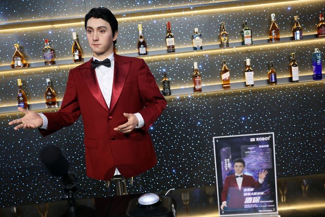 A humanoid robot in the role of a “bartender” gestures at a robot-themed restaurant at Robot Mall in Beijing, China on August 6, 2025. The store opens to the public on Friday, August 8. (Photo by Florence Lo/Reuters)