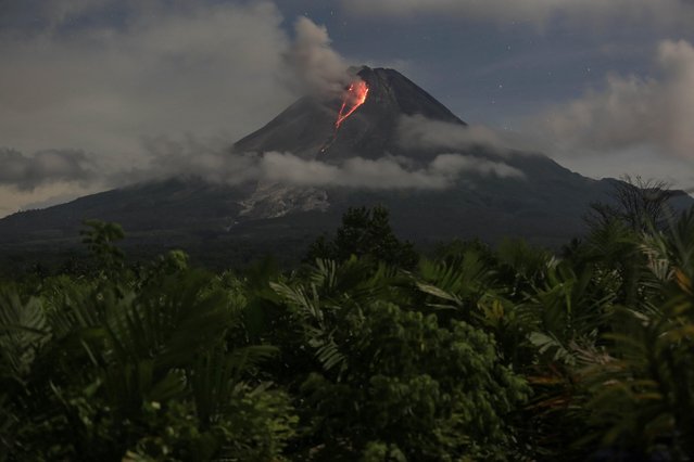 Mount Merapi volcano spews hot lava, as seen from Turi, in Sleman, Yogyakarta, Indonesia on March 13, 2023. (Photo by Hendra Nurdiyansyah/Antara Foto via Reuters)