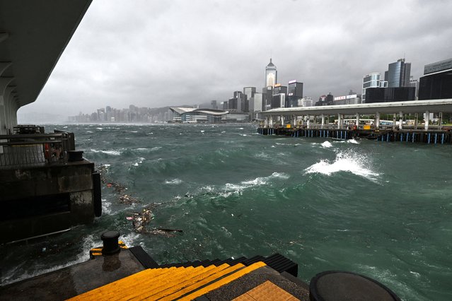 Dark clouds gather and rough seas are seen in Victoria harbour as the typhoon signal number 10 is hoisted as Typhoon Wipha moves towards Hong Kong on July 20, 2025. (Photo by Peter Parks/AFP Photo)