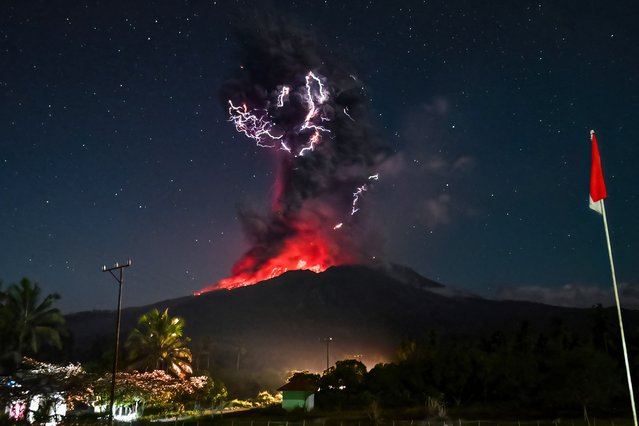 This handout photo taken and released on August 1, 2025 by Indonesia's Geological Agency shows Mount Lewotobi Laki-Laki spewing lava and volcanic ash up to approximately 10 kilometres high during its eruption as observed from the monitoring post in East Flores, in East Nusa Tenggara province. A volcano in eastern Indonesia erupted on August 1, belching an ash tower 10 kilometres (6.2 miles) into the sky, the country's volcanology agency said, weeks after another huge eruption triggered dozens of flight cancellations to and from Bali. (Photo by Indonesia's Geological Agency/AFP Photo)