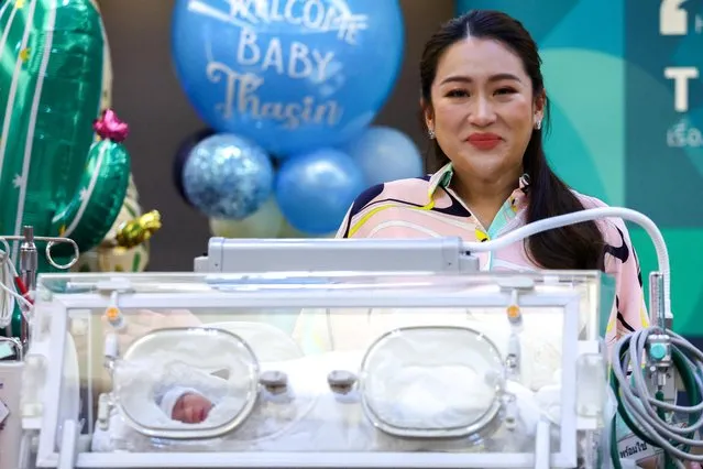 Pheu Thai's leading prime ministerial candidate, Paetongtarn Shinawatra, daughter of former Prime Minister Thaksin Shinawatra, stands next to an incubator containing her newborn baby Prutthasin Sooksawas, during a news conference in Bangkok, Thailand on May 3, 2023. (Photo by Athit Perawongmetha/Reuters)