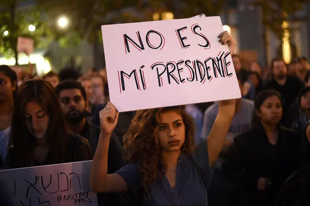 Kimmy, who declined to give a last name, rallies with protesters in Oakland, California, U.S. following the election of Donald Trump as President of the United States November 9, 2016. The sign reads: “He is not my president”. (Photo by Noah Berger/Reuters)