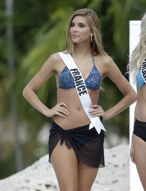 In this January 14, 2015, file photo, Miss Universe contestant Camille Cerf, of France, walks along the pool during the Yamamay swimsuit runway show in Doral, Fla.  (Photo by Lynne Sladky/AP Photo)