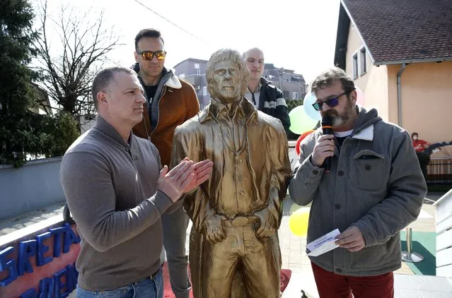 Founders of Chuck Norris 366 independent party seapk to the media in front of a Chuck Norris statue at the 'Norris Cafe' during the founding assembly of the Chuck Norris party for the city's local elections in the capital of Zagreb, Croatia, 10 March 2021. Aleksandar Cubrilo, art director and owner of the cafe, decided to establish an independent party named “Chuck Norris 366” for Zagreb's local elections on US actor Chuck Norris's 81st birthday on 10 March 2021. (Photo by Antonio Bat/EPA/EFE)