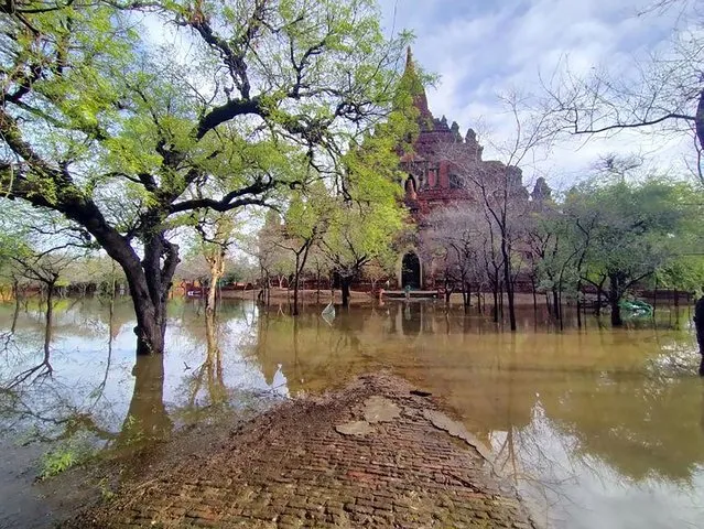 In this photo provided by Myanmar Military True News Information Team on Monday, May 15, 2023, a flooded area caused by Cyclone Mocha is seen near old temple in Bagan, central Myanmar. Rescuers early Monday evacuated about 1,000 people trapped by seawater 3.6 meters (12 feet ) deep along western Myanmar's coast after the powerful cyclone injured hundreds and cut off communications. (Photo by Military True News Information Team via AP Photo)