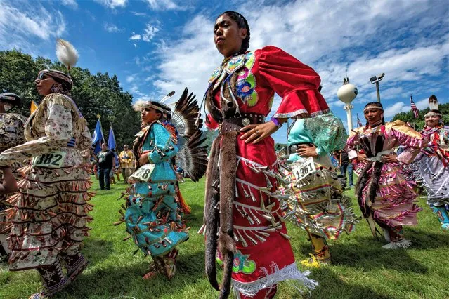 People dance during the Mashantucket Pequot Tribal Nations’ Schemitzun: Feast of the green corn and dance at Mashantucket Pequot Cultural Grounds in Mashantucket, Connecticut, on August 26, 2023. (Photo by Joseph Prezioso/AFP Photo)