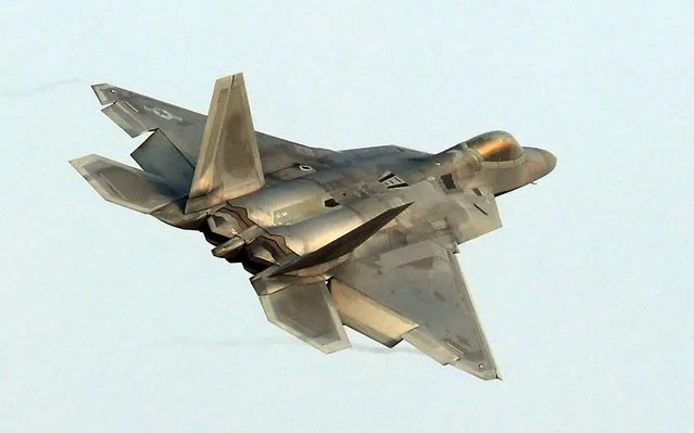 A US Air Force F-22 Raptor stealth jet flies over a South Korean air base in Gwangju on December 4, 2017 The US and South Korea on December 4 kicked off their largest ever joint air exercise, an operation North Korea has labelled an “all- out provocation”, days after Pyongyang fired its most powerful intercontinental ballistic missile. (Photo by AFP Photo/Yonhap)