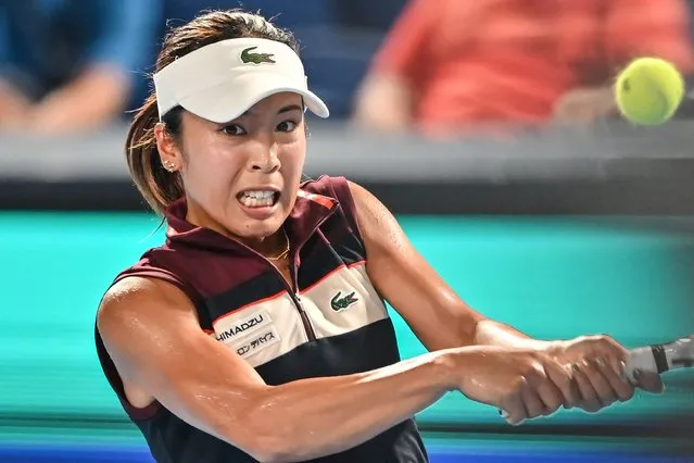 Mai Hontama of Japan hits a return against Iga Swiatek of Poland during their women's singles match on day three of the Pan Pacific Open tennis tournament in Tokyo on September 27, 2023. (Photo by Richard A. Brooks/AFP Photo)