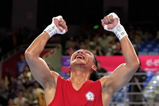 Taiwan's Kan Chia-Wei celebrates after defeating Turkmenistan's Bayramdurdy Nurmuhammedov during the men's 63.5-71kg semifinal boxing match at the 19th Asian Games in Hangzhou, China, Hangzhou, Tuesday, October 3, 2023. (Photo by Aijaz Rahi/AP Photo)