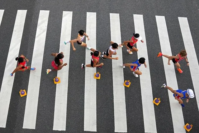 Runners compete in the women's marathon at the 19th Asian Games in Hangzhou, China, Thursday, October 5, 2023. (Photo by Aijaz Rahi/AP Photo)