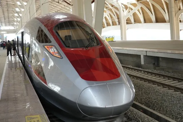 A high-speed train is parked during a test ride at Halim station in Jakarta, Indonesia, on September 18, 2023. Indonesia is launching Southeast Asia’s first high-speed railway, a key project under China’s Belt and Road infrastructure initiative that will cut travel time between the capital and another major city from the current three hours to about 40 minutes. (Photo by Achmad Ibrahim/AP Photo)
