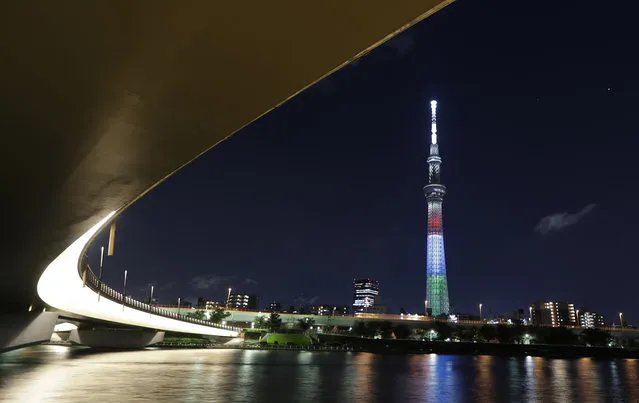 The Tokyo Skytree shows a special lighting in red, blue and green, the symbol colors of the Tokyo 2020 Paralympic Games, in Tokyo on Monday, August 24, 2020. The lighting Monday marked one year to go before the planned opening of the Paralympics that was postponed this summer due to the coronavirus pandemic. (Photo by Hiro Komae/AP Photo)
